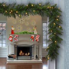 a christmas fireplace with stockings and stockings hanging from it's mantle, surrounded by snowflakes