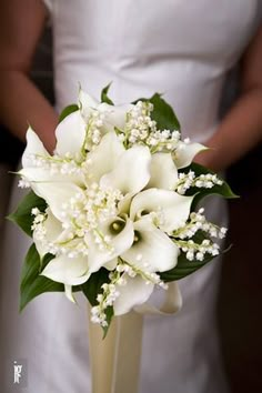 a wedding bouquet with white flowers is displayed on the instagram page for pinterest