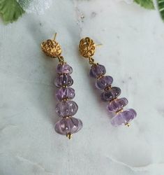 Carved Flower Amethyst 24 K Gold Filled Long Post Earrings, Amethyst Jewelry Gift, Natural Amethyst Gemstones, February Birthstone. These unique earrings have a drop length of 2" ( 50 mm.) and have ornate french 24 K gold filled. Precautions when purchasing *The color may look different on the screen than in the actual product. *Products using natural stone may have inclusions or cracks.  Please understand that it is also a unique feature of natural stone. * Processing time is 3 - 5 days.  * US Purple Amethyst Spiritual Earrings, Spiritual Amethyst Purple Earrings, Spiritual Purple Amethyst Earrings, Handmade Amethyst Earrings For Wedding, Handmade Amethyst Wedding Earrings, Lavender Amethyst Earrings With Gemstone Accents, Lavender Amethyst Earrings With Natural Stones, Wedding Amethyst Earrings With Natural Stones, Lavender Amethyst Gemstone Earrings