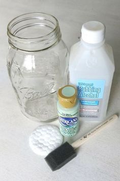 the contents of a mason jar are shown with toothbrushes, glue and other items