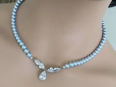 Wedding Light Blue Blush Blue Pearl Silver Choker Bridal Necklace. NECKLACE is about 18 inches (45.7cm) long. BACKDROP is about 4 inches (10.1cm). JEWELRY SETS SECTION: https://www.etsy.com/shop/LanaChayka?ref=seller-platform-mcnav§ion_id=18873488 BRIDAL JEWELRY SETS SECTION: https://www.etsy.com/shop/LanaChayka?ref=seller-platform-mcnav§ion_id=25839214 BRIDAL NECKLACES SECTION: https://www.etsy.com/shop/LanaChayka?ref=seller-platform-mcnav§ion_id=11638944 Elegant and classy, this stunning neckl Light Blue Crystal Jewelry For Wedding, Light Blue Crystal Wedding Jewelry, Elegant Light Blue Necklace For Wedding, Elegant Light Blue Wedding Necklaces, Elegant Blue Wedding Necklaces, Elegant Blue Wedding Necklace, Blue Pearl Jewelry, Pearl Jewlery, Blue Pearl Necklace