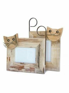 two wooden frames with cats on them and one has a cat's head sticking out of it