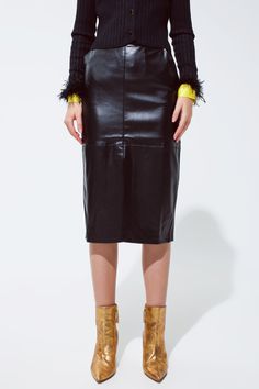 Embrace sophistication and edgy style with our Urban Chic Black Faux Leather Pencil Skirt. This stunning piece is a must-have for fashion-forward individuals looking to make a statement at any occasion or event. Model’s Size and Fit: Showcased by our graceful model in a size S, the skirt provides a perfect fit for her measurements of 31-23-35 and a height of 5'10''. Designed with precision, the skirt offers a true-to-size fit, ensuring both comfort and style. Luxurious Fabric Blend: Crafted from