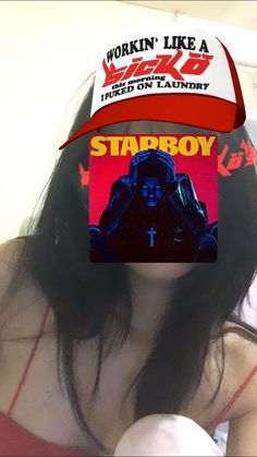 a woman wearing a red hat with the word stabboy on it's side