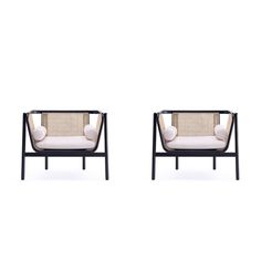 two chairs sitting next to each other on a white background