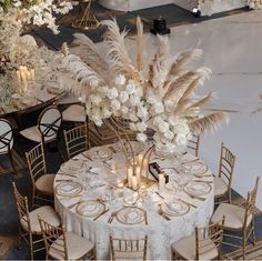 the centerpieces and tables are decorated with white flowers