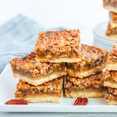 several pieces of pecan bars stacked on top of each other