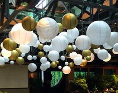 many white and gold lanterns hanging from the ceiling