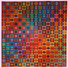 a multicolored quilt with squares and rectangles