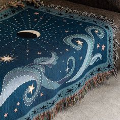 a blanket that is on the floor with stars