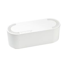 a white speaker sitting on top of a table