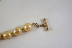 "Carolee faux champagne color glass baroque pearl necklace Measures 17 inches long gold vermeil over sterling toggle style clasp the pearls are 1/2\" wide and long Excellent condition on beads" Pearl Fashion, Baroque Pearl Necklace, Domed Ring, Champagne Color, Baroque Pearls, Cross Pendant, Gold Vermeil, Necklace Etsy, Pearl Necklace