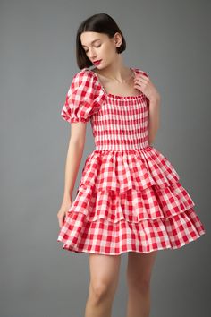 Looking for a playful and flattering dress? Our Gingham Mini Dress is perfect for any occasion! The gingham print is both timeless and chic, while the smocked detail and puff sleeves add a touch of whimsy. The lined bodice ensures a comfortable and flattering fit, while the mini length is perfect for showing off your legs! Whether you're headed to a picnic or a summer party, this dress is sure to turn heads! Gingham print Lined Puff sleeves Smocked detail Shell; 85% Cotton 15% Tencel Lining; 100% Cotton TL432D Total length: 35" Bust: 31.50" S Height 5'9" / Bust 32" / Waist 24" / Hip 35" Picnic Gingham Dress With Ruffles, Cute Gingham Smocked Dress With Ruffles, Gingham Dresses With Ruffles For Picnic, Gingham Dress With Ruffles For Picnic, Picnic Mini Dress With Smocked Bodice, Picnic Mini Length Dress With Smocked Bodice, Mini Length Smocked Bodice Dress For Picnic, Mini Length Dresses With Smocked Bodice For Picnic, Square Neck Plaid Dress For Picnic