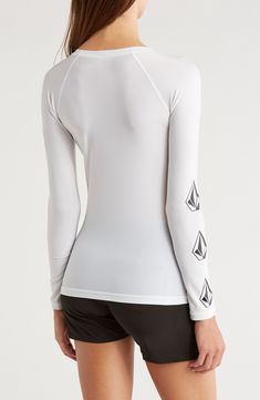 Long sleeves extend your comfort in the sun in this rashguard made from a quick-drying fabric with plenty of stretch to keep you moving. 24 1/2" length (size Medium) Crewneck Long sleeves UPF 50+ sun protection 86% polyester, 14% elastane Hand wash, line dry Imported Stretch Crew Neck Rash Guard For Surfing, Moisture-wicking Fitted Crew Neck Rash Guard, Sporty Compression Moisture-wicking Rash Guard, Fitted Crew Neck Rash Guard For Surfing, Moisture-wicking Crew Neck Top For Water Sports, Fitted Uv Protection Tops For Surfing, Fitted Tops With Uv Protection For Surfing, Sporty Black Tops For Water Sports, White Stretch Long Sleeve Swimwear