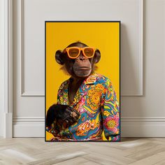 a monkey wearing sunglasses and holding a small animal in front of a yellow background with an orange frame