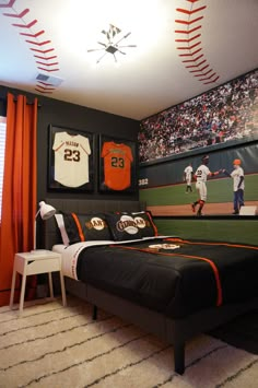 a baseball themed bedroom with an orange and black theme