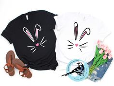 two t - shirts with bunny ears on them next to flowers and sandals, one has a pair of flip flops