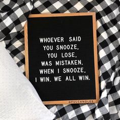 a sign that says whoever said you snooze, you lose, was taken, when i snooze, i win we all win