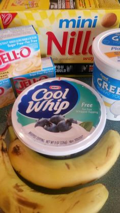 yogurt and bananas on a counter top