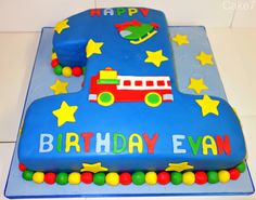 a birthday cake that is shaped like a firetruck and has stars on it