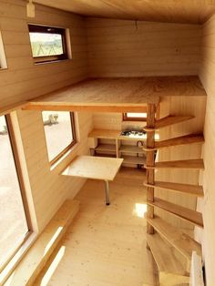 the inside of a tiny house with stairs