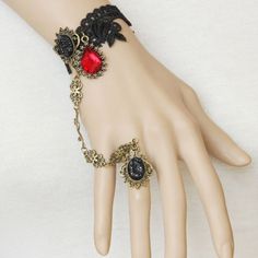 Include: Bracelet Product Code:  LIN01249 Color:  Black Gender:  Female Materials:  Lace,Bronze Accessories,Resin Diamonds Notice:  Other Accessories Are Not Included Length:  13cm Width:  2.8cm Trend:  Fashion Vampire Retro Court Gothic Handmade Lace Female Christmas Party Bracelet The width of the lace is about 2.8cm, and the narrow part is about 1cm. The length of the front decorative part of the normal size is about 13cm, including the two metal pieces with lace. Behind is the button and adj Vampire Ring, Bronze Accessories, Gothic Engagement Ring, Gothic Bracelet, Lace Bracelet, Bracelets Design, Wristband Bracelet, Rose Lace, Handmade Lace