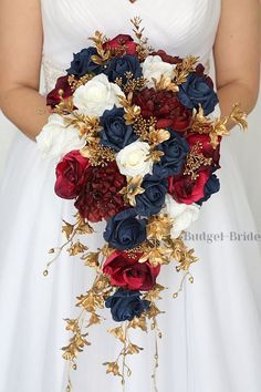 a bride holding a bouquet of red, white and blue flowers