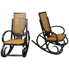 two wooden rocking chairs with wicker seats on each one and the other side facing different directions