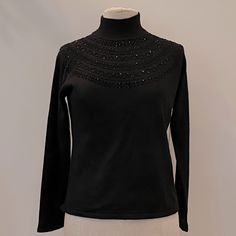 New Vintage Rena Rowan Black Turtleneck W Embellishment Around Neck. New With Tags Condition New Womens Size M Measurements 18 3/4 Pit-Pit 22 Length Acrylic / Wool Elegant Winter Tops With Sequins, Elegant Winter Sequin Tops, Elegant Sequined Winter Tops, Elegant Sequined Tops For Winter, Black Long Sleeve Tops With Embellished Collar, Black Long Sleeve Top With Embellished Collar, Black Party Top With Embellished Collar, Elegant Evening Top With Embellished Collar, Party Black Top With Embellished Collar