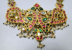 "20 carat solid gold, Old cut Diamonds ,Rubies and Emerald necklace (Kundan Meena choker). A large necklace Ideal for special occasions set with eye popping clear old cut genuine Diamonds Rubies and emaralds. A solid piece of jewelry good for family Heirloom which will last for ever.great workmanship and great value for Money. Length of necklace -30 cm (11.81\") free size easy to adjust according to your requierment by adding adjustable cord. Size of center pendant-8/5.5 cm, total weight -99.400 Polki Diamond Necklace, Large Necklace, Solid Gold Necklace, Gold Bead Bracelets, Gold Jewelry Necklace, Emerald Necklace, 925 Silver Earrings, Star Earrings, Free Jewelry