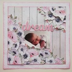 a baby's photo frame with flowers and the word dream written in pink on it