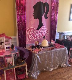 a barbie birthday party with pink and purple decorations