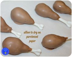 there are chocolate candies with white icing on them that say, allow to day on parchment paper