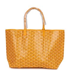 This St. Louis PM tote is of yellow Goyardine canvas with palladium hardware, contrast stitching, and has a matching detachable button closure wallet The interior is lined with white canvas.Origin: FranceCondition: New and never worn Accompanied by: Dustbag and felt Measurements: 11" x 6" x 13.3"; 7" shoulder strap Luxury Large Capacity Yellow Bags, Designer Shoulder Bag With Leather Handles In Yellow, Designer Yellow Shoulder Bag With Leather Handles, Luxury Yellow Shopping Bag, Luxury Large Capacity Yellow Shoulder Bag, Designer Large Capacity Yellow Bag, Yellow Rectangular Coated Canvas Bag, Luxury Yellow Tote Bag, Luxury Yellow Shoulder Bag For Everyday