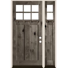 the front door is made out of wood and has two sidelights on each side