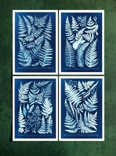 four blue and white paper cut art prints with leaves on the sides, set of 4