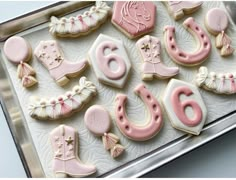 decorated cookies in the shape of numbers and boots