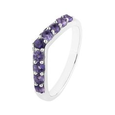 a white gold ring with purple stones