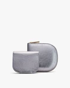 A transformative 2-in-1 compact wallet, crafted from premium Italian leather with a contrasting interior and removable cardholder for a perfect everyday partner. Modern Coin Purse With Card Slots, Modern Compact Coin Purse With Rfid Blocking, Modern Compact Coin Purse With Interior Card Slots, Modern Silver Wallet For Gift, Modern Compact Coin Purse, Modern Compact Wallet With Removable Pouch, Modern Compact Wallet With Rfid Blocking, Luxury Textured Leather Everyday Pouch, Modern Silver Wallet With Card Slots