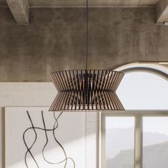 a wooden light fixture hanging from the ceiling