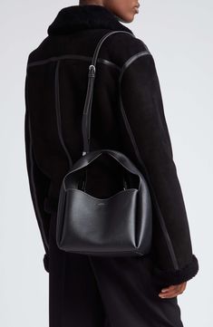 Sculpted from grained leather in a cube silhouette, this bucket bag offers plenty of room for the everyday essentials while retaining a lightweight feel. Carry the versatile look by the folded handle or attach the adjustable strap for shoulder wear. Bridge-clip closure Top carry handle; removable, adjustable shoulder strap Interior wall pocket; card slot Leather Made in Italy Designer Handbags Leather Box Bag With Detachable Handle In Bucket Shape, Leather Box Bag With Detachable Handle And Bucket Shape, Workwear Top Handle Bucket Bag, Soft Leather Top Handle Bucket Bag For Work, Soft Leather Bucket Bag With Top Handle For Work, Top Handle Bucket Bag With Detachable Handle For Work, Modern Bucket Bag With Detachable Handle For Work, Modern Bucket Bag For Work With Top Carry Handle, Modern Soft Leather Bucket Satchel