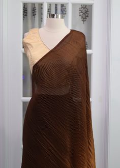 Pleated crushed saree Fabric: Georgette Size 40 Festive Brown Blouse Piece, Semi-stitched Saree With Padded Blouse, Unstitched Brown Saree, Brown Unstitched Saree, Bollywood Georgette Pre-draped Saree With Padded Blouse, Elegant Brown Saree, Padded Georgette Pre-draped Saree, Festive Unstitched Brown Blouse Piece, Festive Brown Unstitched Blouse Piece