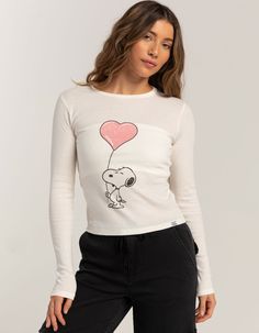 Rsq X Peanuts Love Collection Womens Snoopy Heart Long Sleeve Baby Tee. Large Graphic Screened On Front. Ribbed Crew Neckline. Long Sleeve. Fitted Silhouette. 50% Cotton, 50% Polyester. Machine Wash. Imported. Model Is Wearing A Size Medium. Model Measurements:height: 5'7" Bust: 34.5"waist: 27"hips: 38" | Rsq X Peanuts Love Collection Snoopy Heart Long Sleeve Baby Tee Playful Fitted Tops With Character Print, Fitted Playful Tops With Character Print, Cute Long Sleeve Tops With Heart Graphic, Cute Long Sleeve Top With Heart Graphic, Cute Tops With Heart Graphic For Spring, Cute Fitted Top With Character Print, Playful Fitted Crew Neck Top, Fitted Long Sleeve Top With Cartoon Print, Cute Cotton Tops With Heart Print