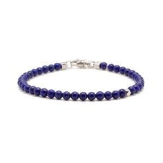 Handcrafted with rich blue Lapis Lazuli and accented with a single sterling silver bead, this piece is an easy and timeless addition to any man's jewelry collection. Sterling Silver Lapiz Lazuli 4mm Thickness Lobster Clasp Handcrafted in LA Lapis Lazuli: Wisdom, Protection, Intellectual Clarity, Emotional Healing Determining your bracelet size: Encircle your wrist with a flexible tape measure and record the measurement. Add 1/2 to 1 inch to your wrist measurement for a comfortable bracelet fit. Classic Blue Round Beads Jewelry, Classic Blue Round Bead Jewelry, Blue Beaded Bracelets With Sterling Silver Clasp, Everyday Blue Jewelry With 8mm Beads, Classic Blue Sterling Silver Bracelets, Pearl Jewelry Gift, Blue Lapis Lazuli, Stacked Jewelry, Blue Lapis