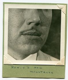 an old black and white photo of a man's face with the words nowie's new mustache