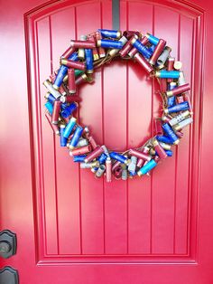 Shotgun Shell Wreath Project Shotgun Shell Art, Shell Casings Crafts, Fall Yarn Wreaths, Bullet Casing Crafts, Ribbon Wreath Diy, Bullet Crafts, Making Mesh Wreaths, Diy Floral Wreath