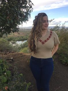 Beige sweater top, v-neck, with flowers on chest. The top fits a small to medium, and has stretch. This1970stop will look cute with a pair of bellbottom pants, or a corderoid skirt. We at AzucarSugar arehappy to have this funky blouse in our AzucarSugar boutique. . . . . . . . . . . . . . . . . . . #hippy #hipster #costume #fashion #1970s #70s #funky #top #blouse #shirt #fashionable #stretch #comfortable #stretchy #brown Funky Blouse, Hipster Costume, Bellbottom Pants, Strick Top, Fashion 1970s, Beige Pullover, Costume Fashion, Real Vintage, Bell Bottom Pants