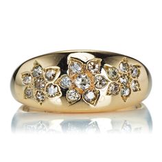 a gold ring with diamonds on it