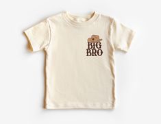 Big Bro Cowboy Hat Toddler Shirt For Boys - Big Brother Sibling Reveal Outfit - Rodeo Western Theme - Boho Natural Toddler & Youth Tee If you love super soft, lightweight, extremely comfy shirts and baby bodysuits then you will absolutely love our unisex kids shirts and baby bodysuits! These shirts are hand printed with a professional garment printer for a soft, durable, long lasting, printed graphic using high quality water based inks. * The printed design is very soft to the touch due to our p Sibling Reveal, Big Brother Tshirt, Big Brother Shirt, Chapeau Cowboy, Shirt For Boys, Brother Shirts, Western Theme, Comfy Shirts, Cowboy Hat