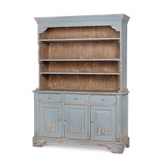 an old blue china cabinet with two doors and drawers on one side, against a white background